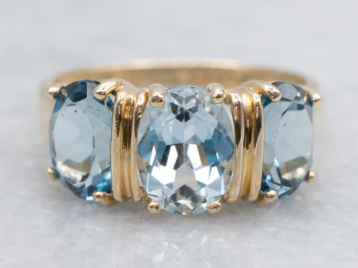 Blue Tones Aquamarine and Topaz Three Stone Ring