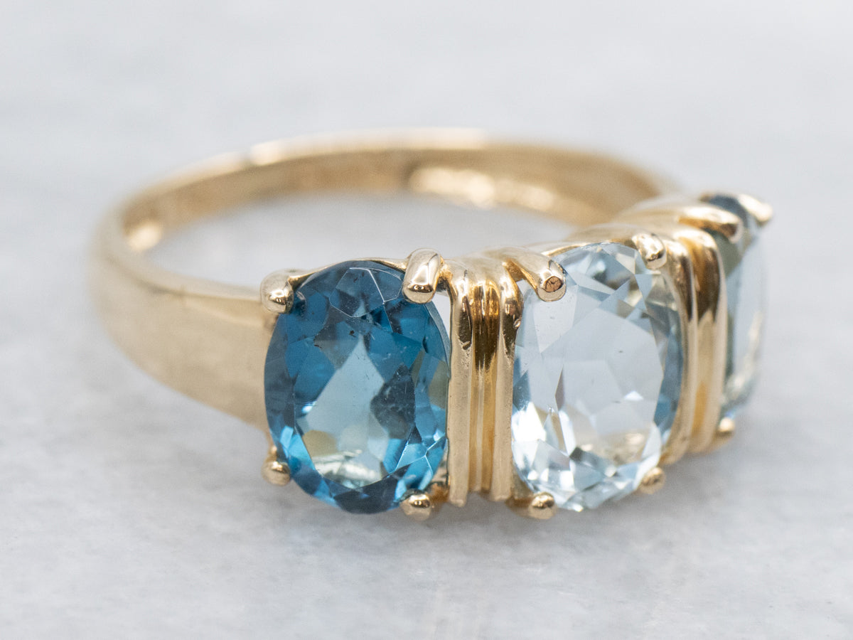 Blue Tones Aquamarine and Topaz Three Stone Ring
