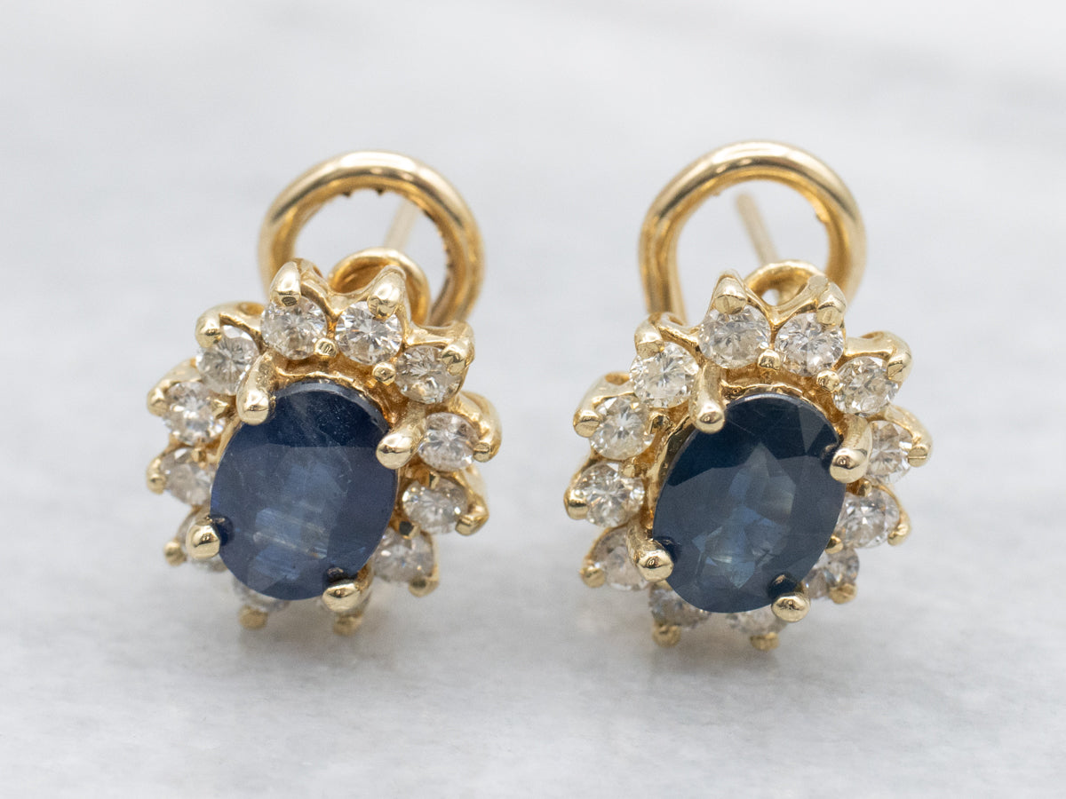 Navy Hued Sapphire and Diamond Halo Yellow Gold Earrings
