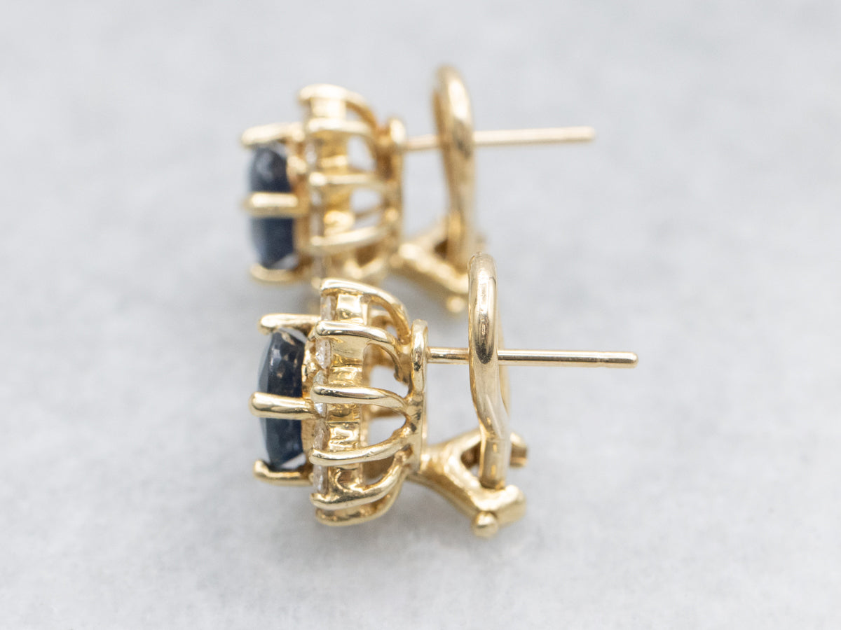 Navy Hued Sapphire and Diamond Halo Yellow Gold Earrings