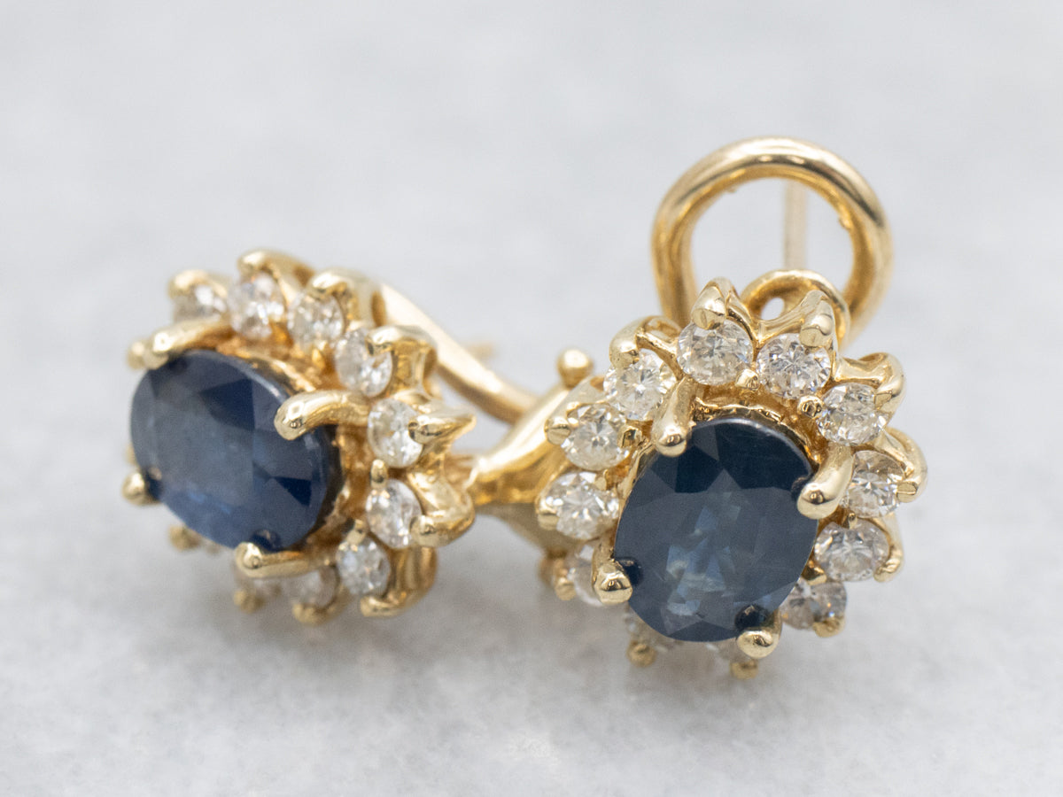 Navy Hued Sapphire and Diamond Halo Yellow Gold Earrings