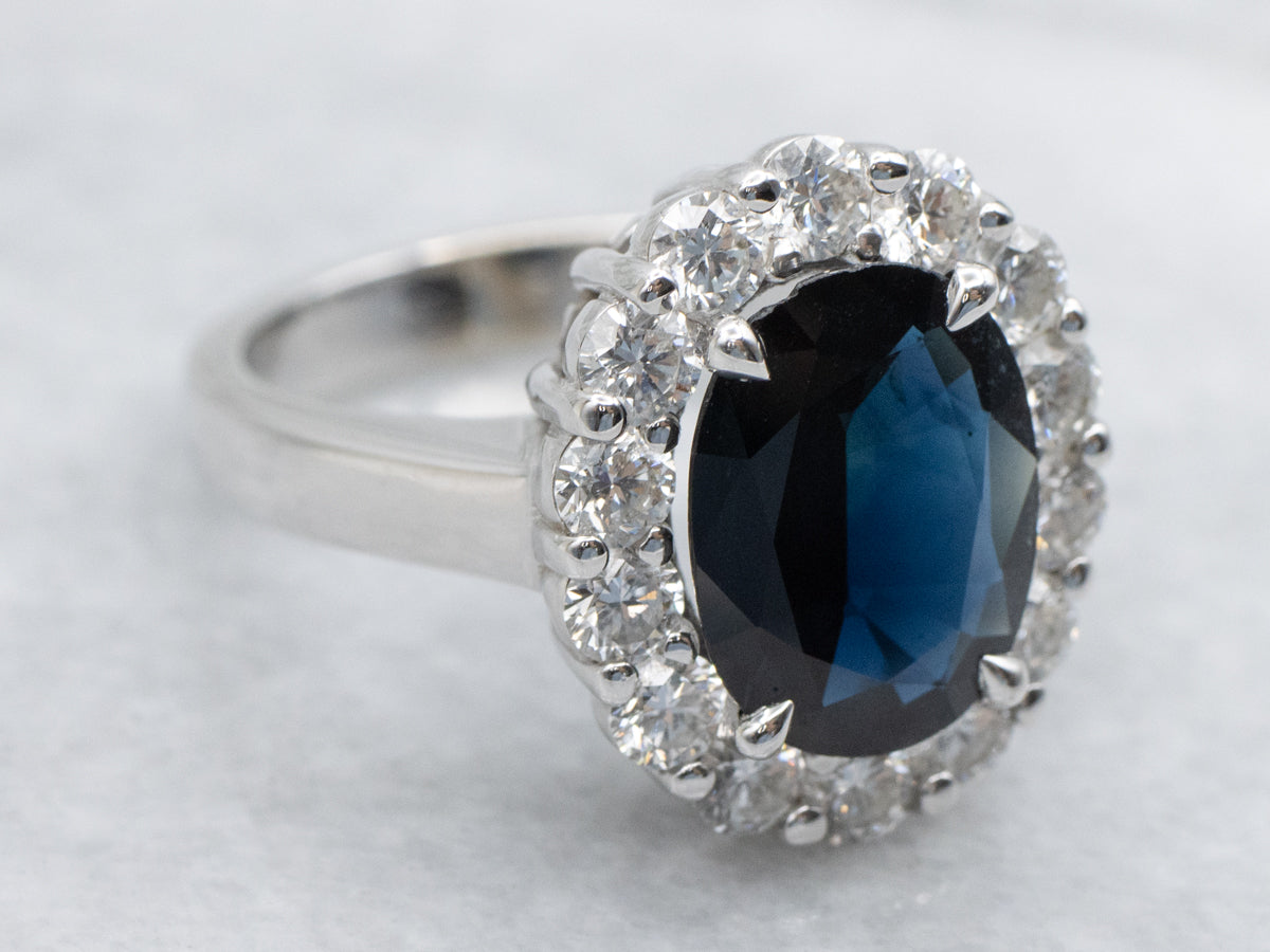 Deep Blue Sapphire and Diamond Modern Halo Ring