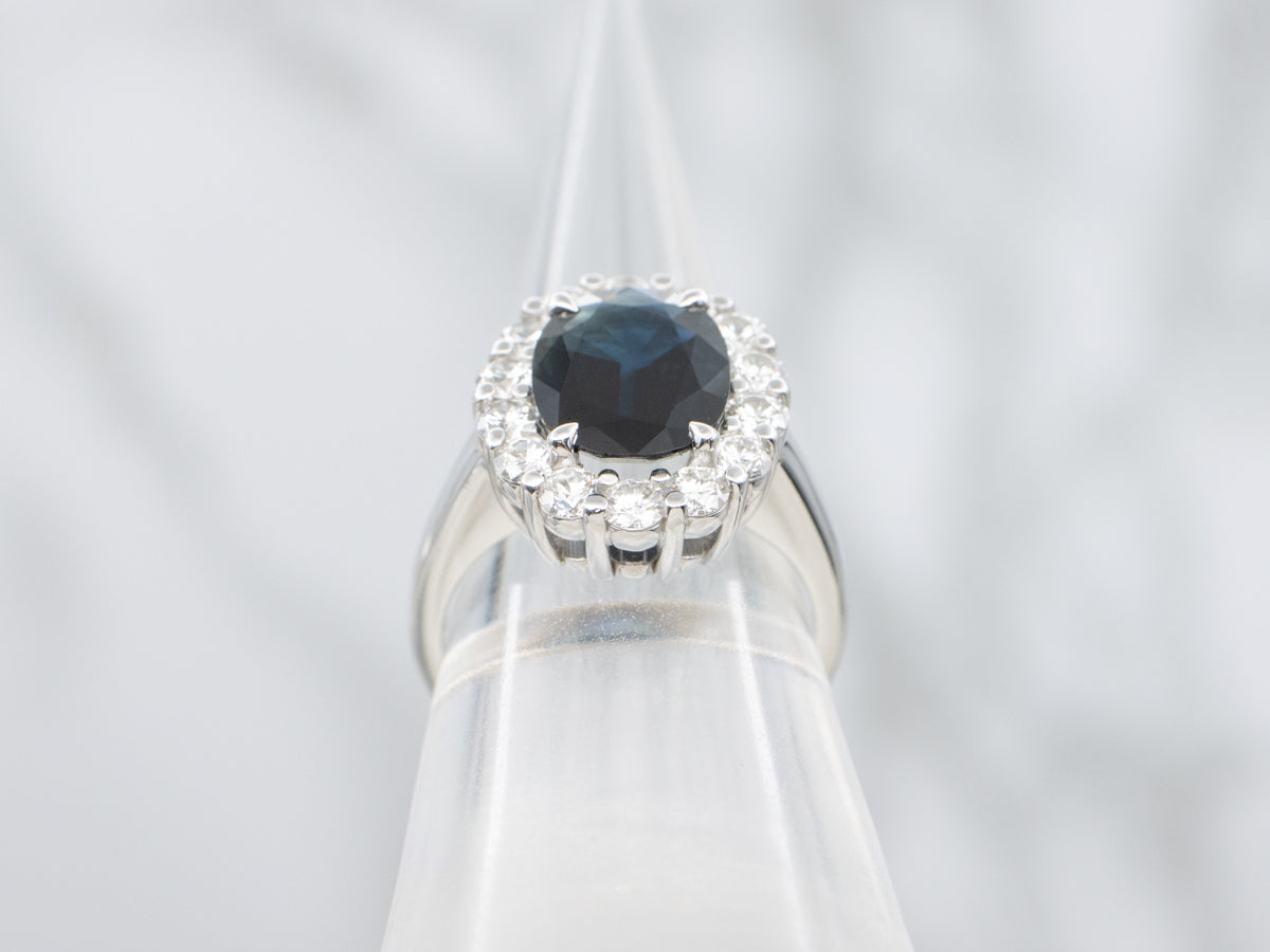 Deep Blue Sapphire and Diamond Modern Halo Ring
