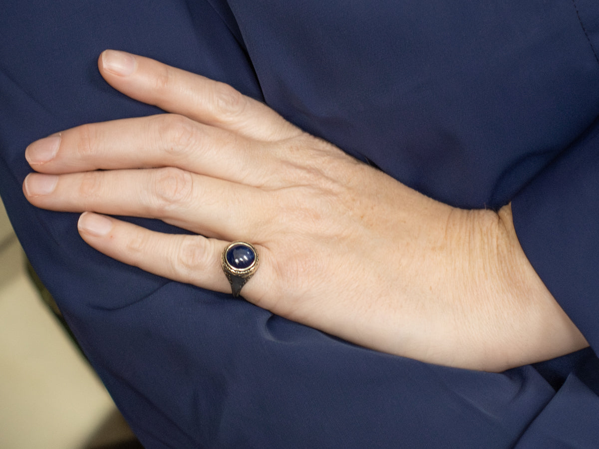 Antique Josten's Sapphire Cabochon Filigree Solitaire Ring