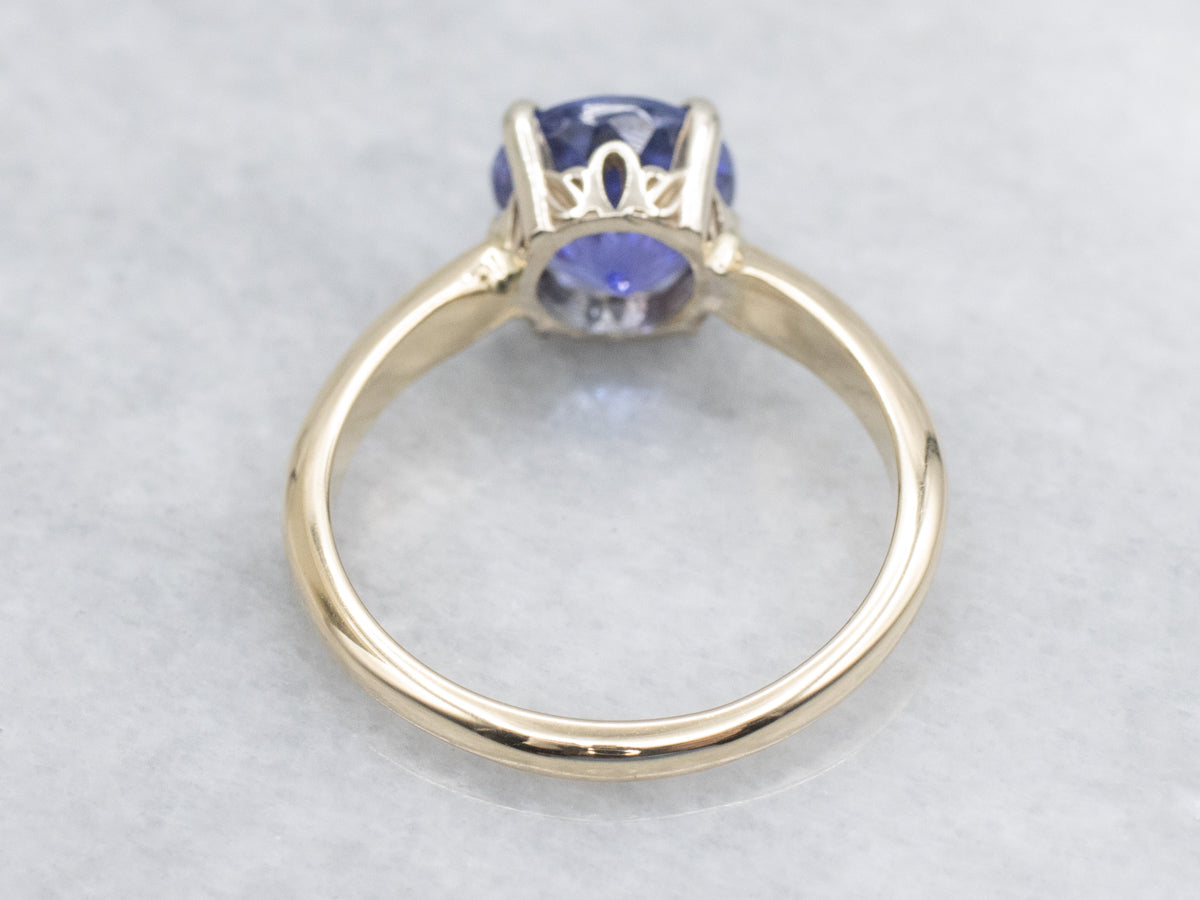 Round Cut Tanzanite Two Tone Gold Solitaire Ring