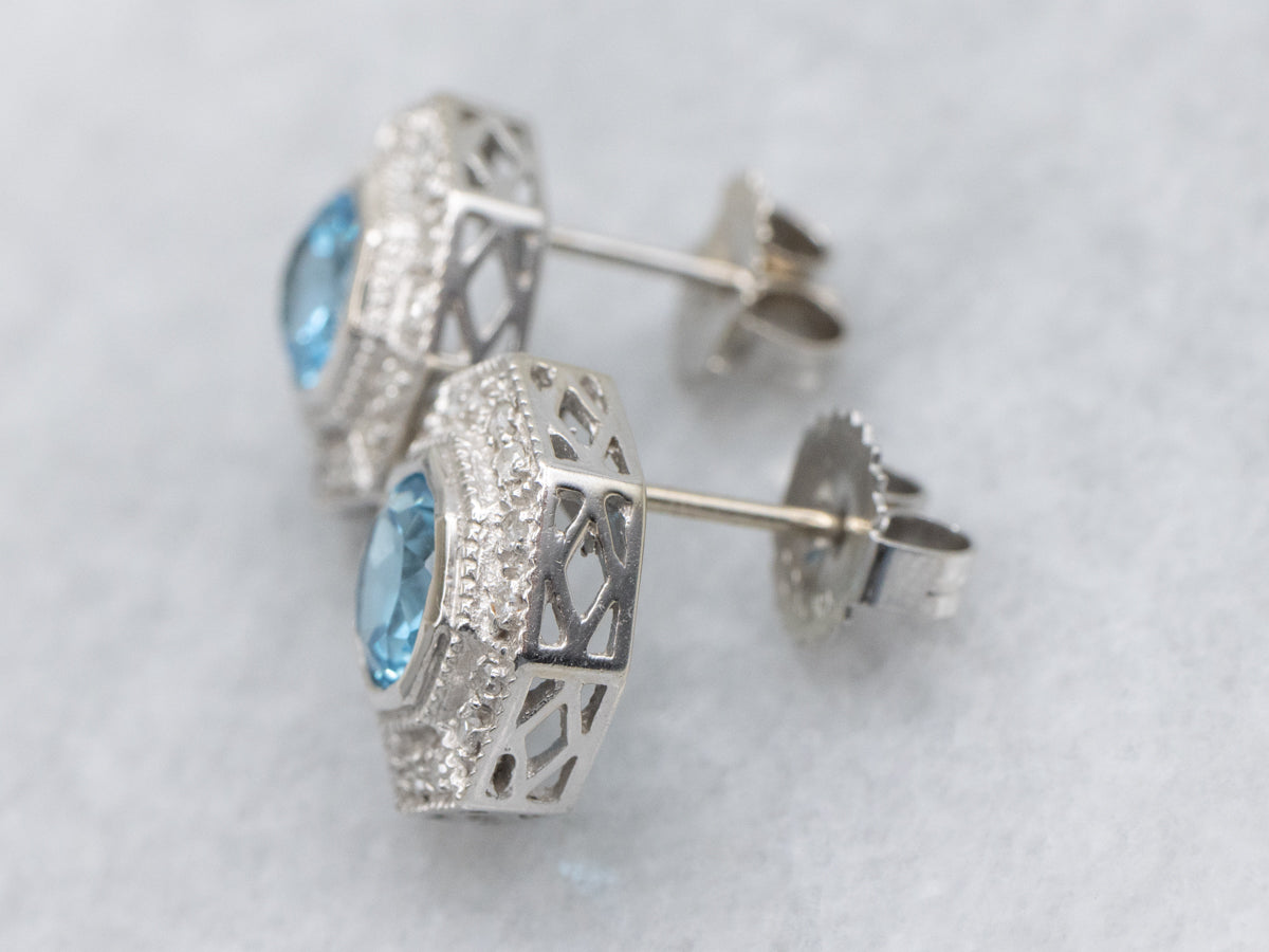 Sparkling Blue Topaz and Diamond Halo Stud Earrings