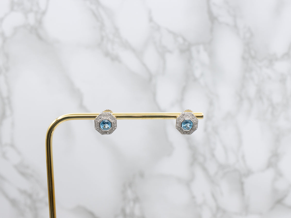 Sparkling Blue Topaz and Diamond Halo Stud Earrings