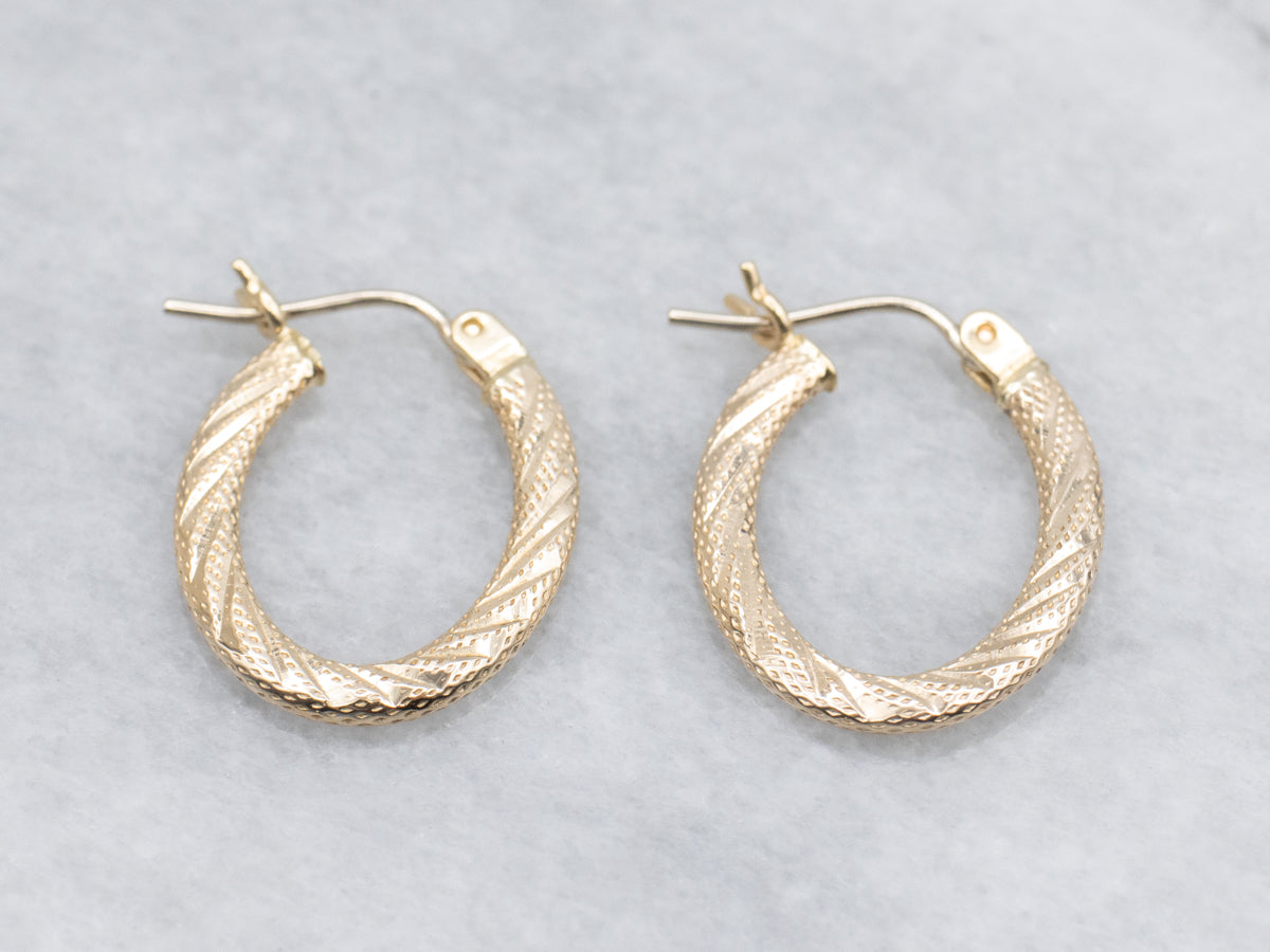 Textured Gold Twisting Oval-Shaped Hoop Earrings