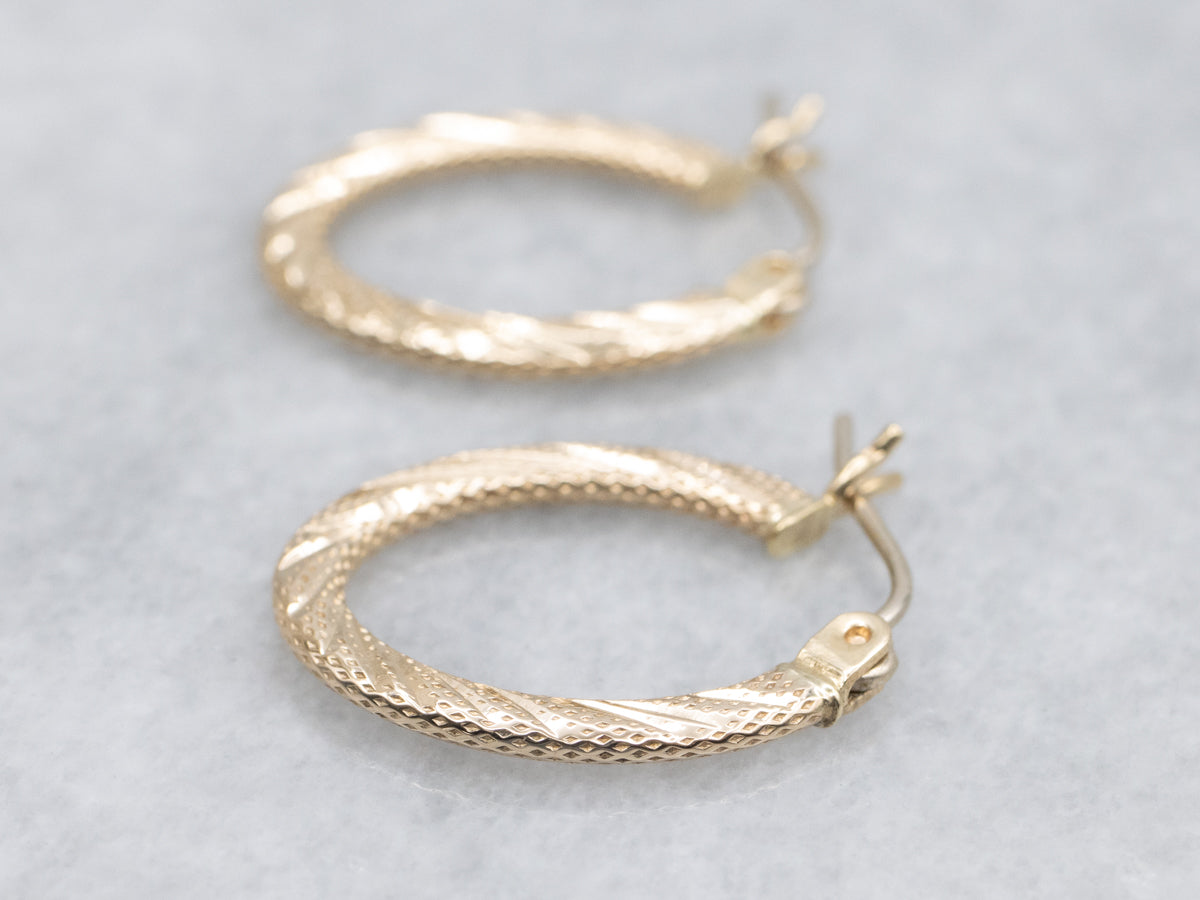 Textured Gold Twisting Oval-Shaped Hoop Earrings