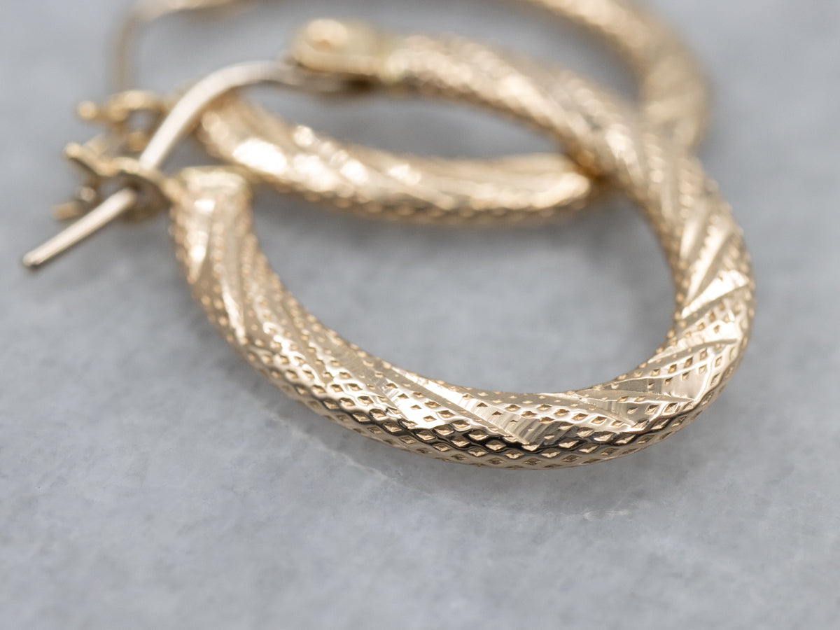 Textured Gold Twisting Oval-Shaped Hoop Earrings