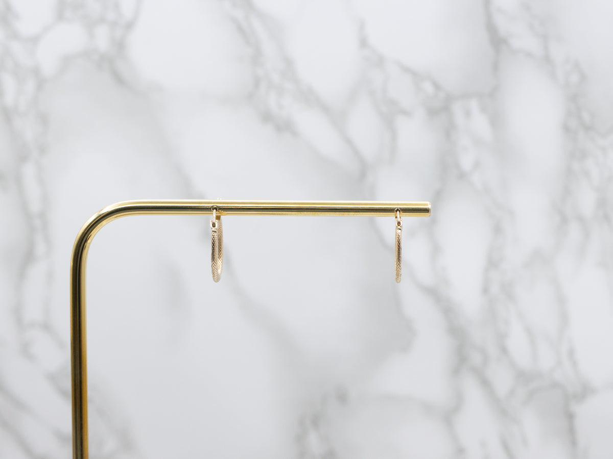 Textured Gold Twisting Oval-Shaped Hoop Earrings