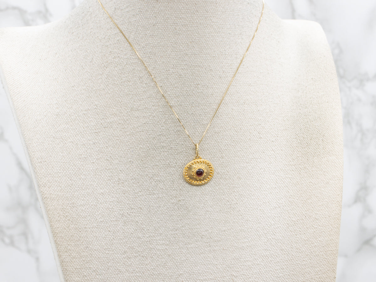 Ornate 18-Karat Gold Garnet Cabochon Pendant