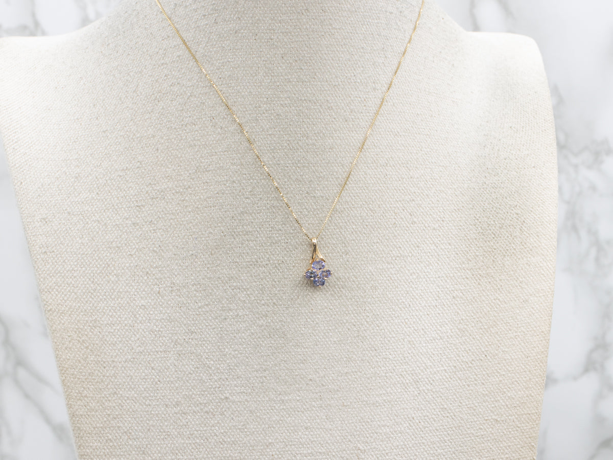 Oval Cut Tanzanite Gold Pendant with Twisted Bail