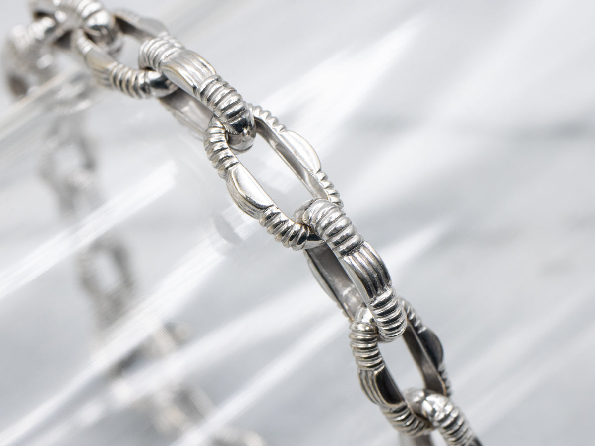 White Gold Nautical Link Bracelet with Diamond Clasp and Ruby Accent