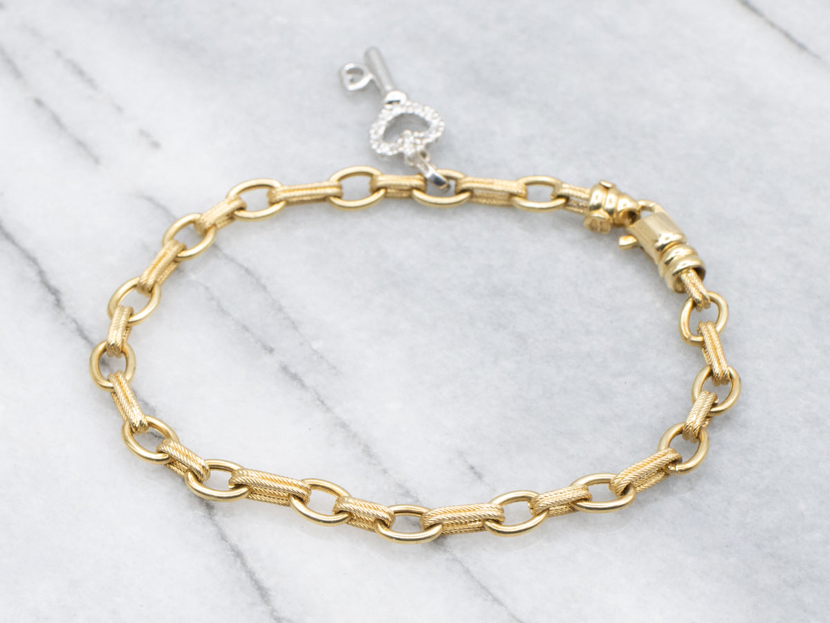 Italian 18-Karat Gold Link Bracelet with Diamond Heart Key Charm