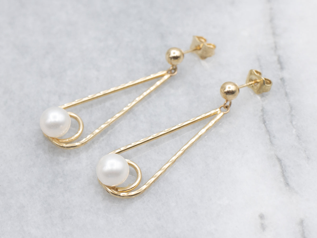 Swinging Gold and Pearl Drop Earrings