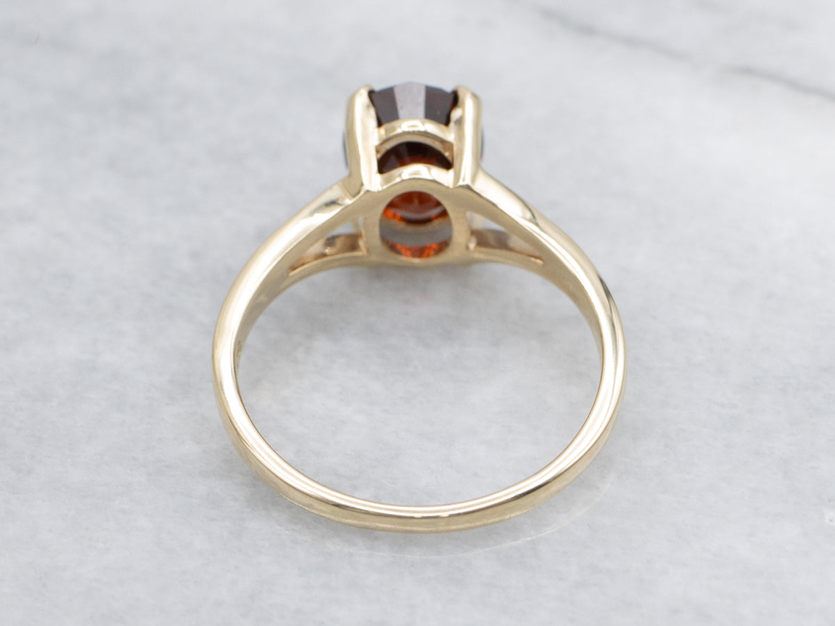 Oval Cut Garnet Yellow Gold Solitaire Ring