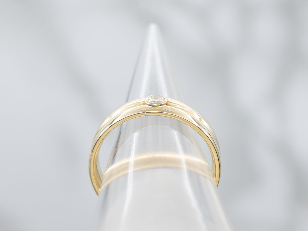 Sleek 18-Karat Gold Bezel-Set Diamond Band