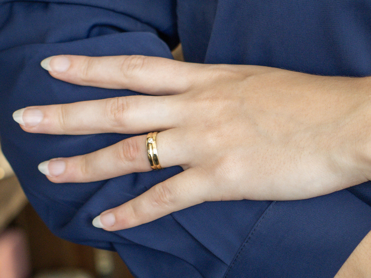 Sleek 18-Karat Gold Bezel-Set Diamond Band