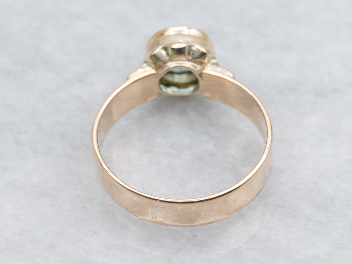 Newly Set Blue Zircon Solitaire in Antique Engraved Gold Setting