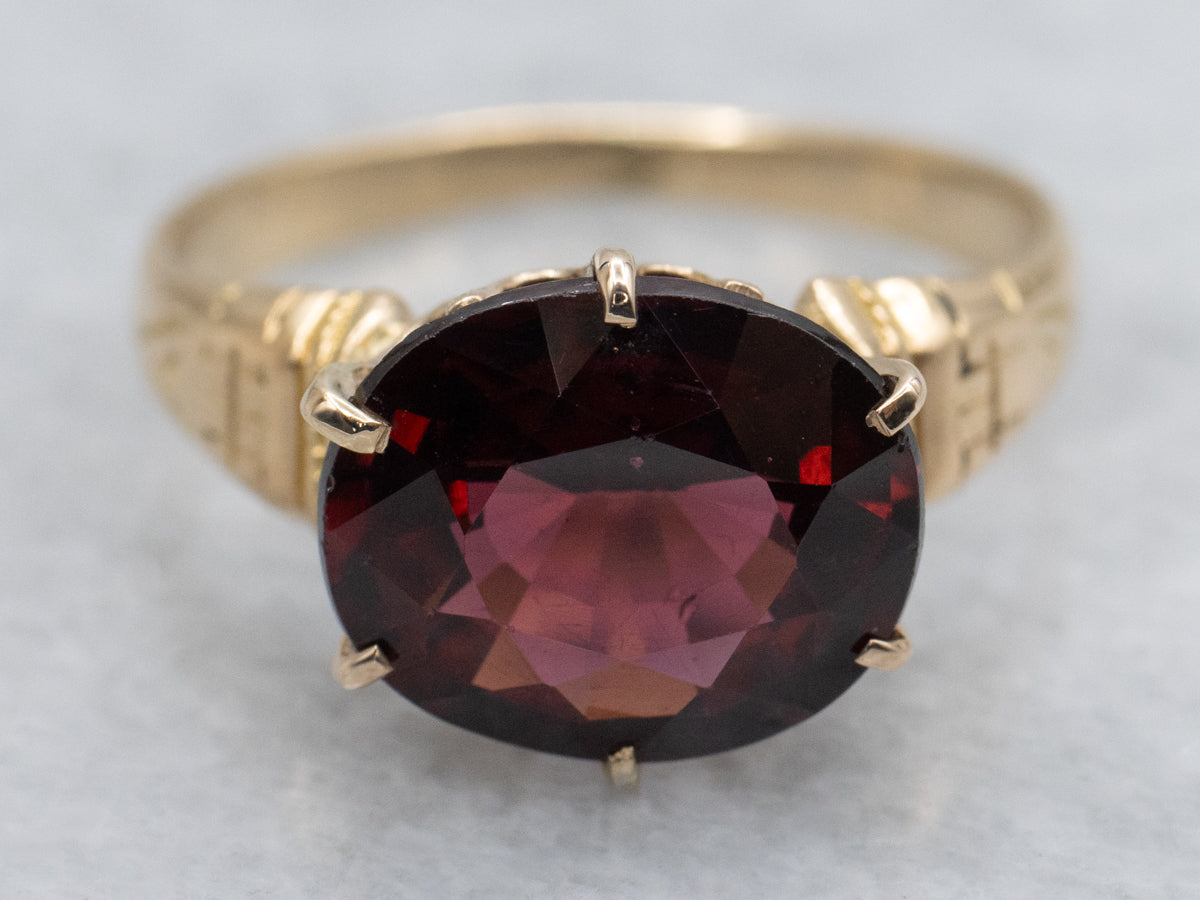 Antique Engraved Gold East-to-West Set Garnet Solitaire Ring