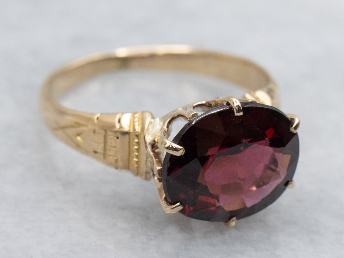 Antique Engraved Gold East-to-West Set Garnet Solitaire Ring