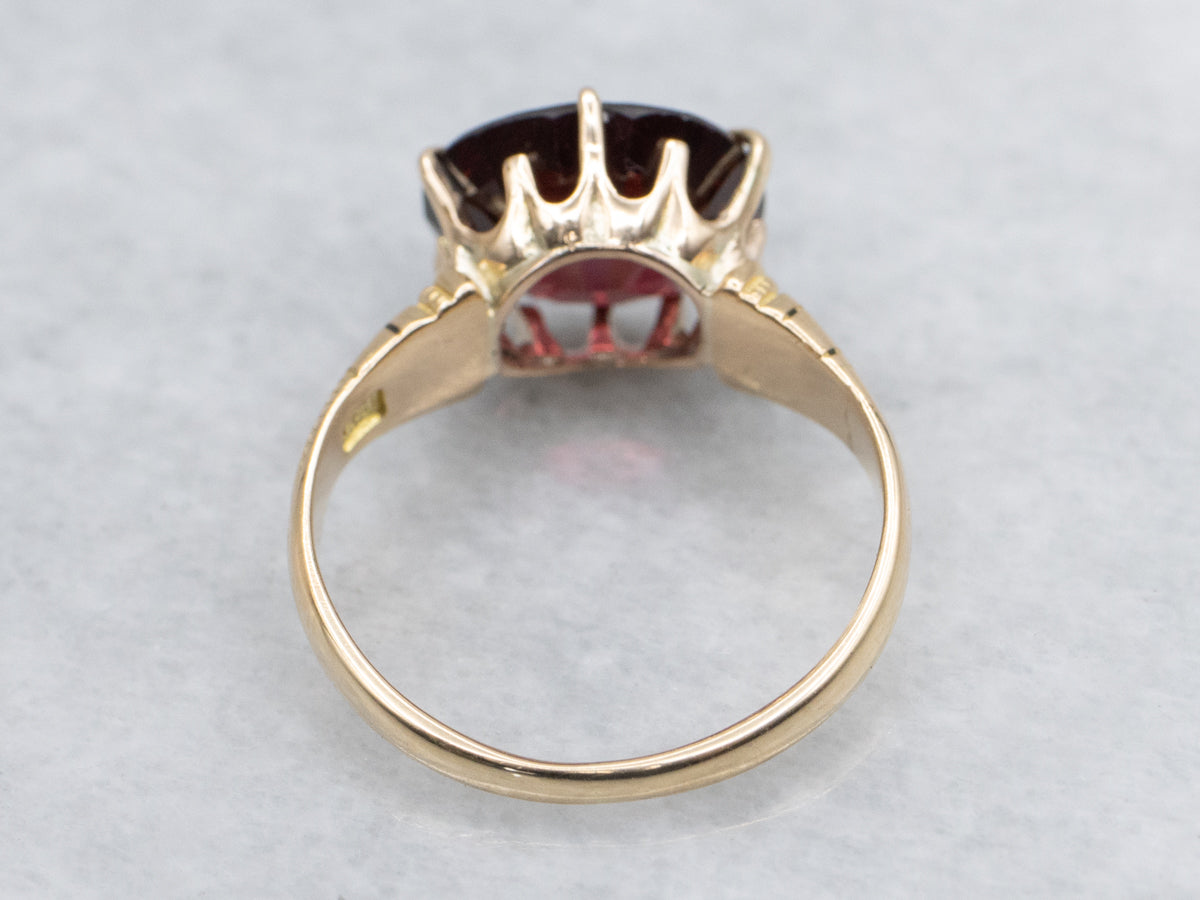 Antique Engraved Gold East-to-West Set Garnet Solitaire Ring
