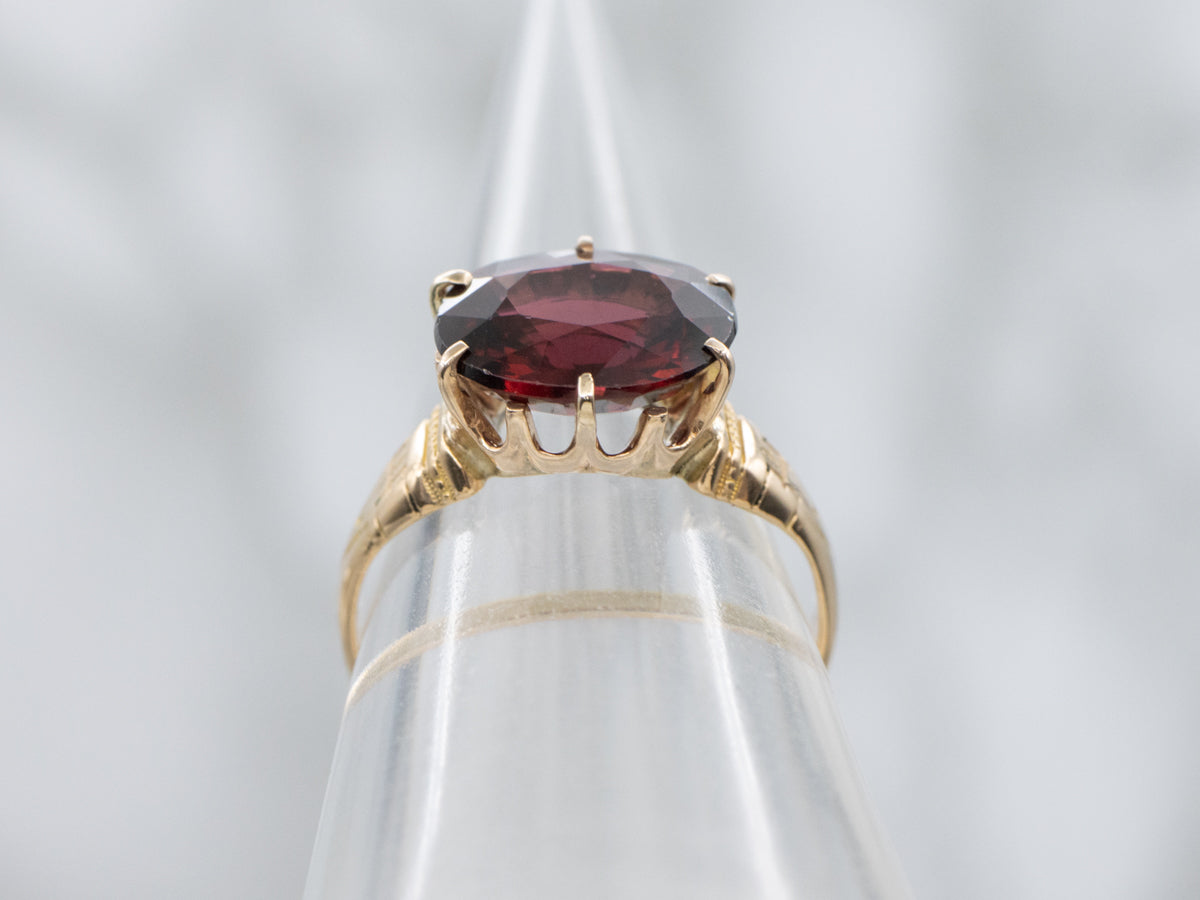 Antique Engraved Gold East-to-West Set Garnet Solitaire Ring