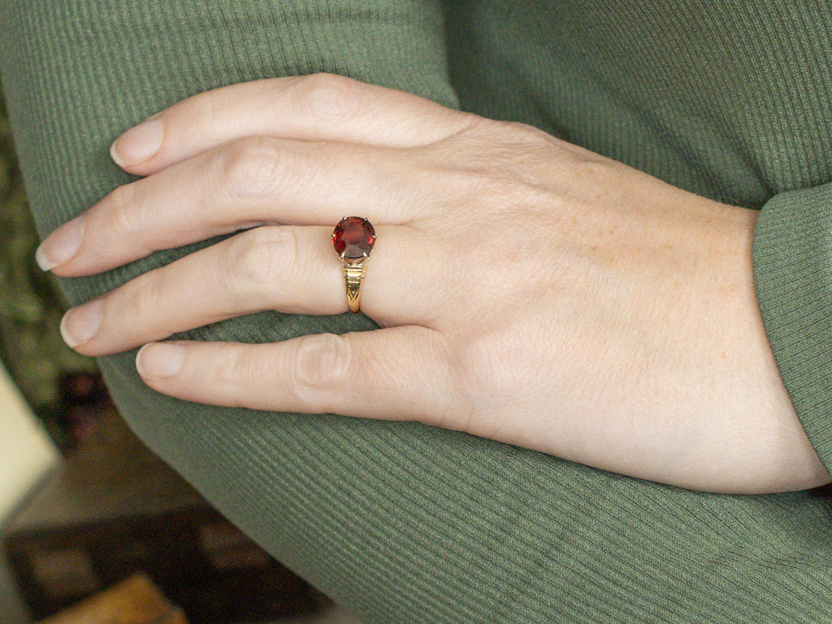 Antique Engraved Gold East-to-West Set Garnet Solitaire Ring