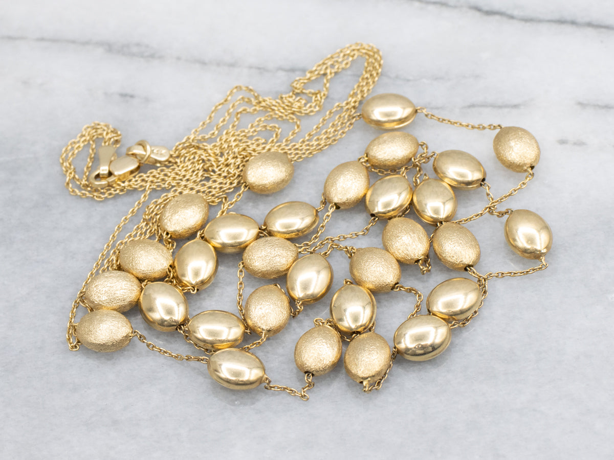 Triple Strand Textured and Polished Oval Bead Necklace