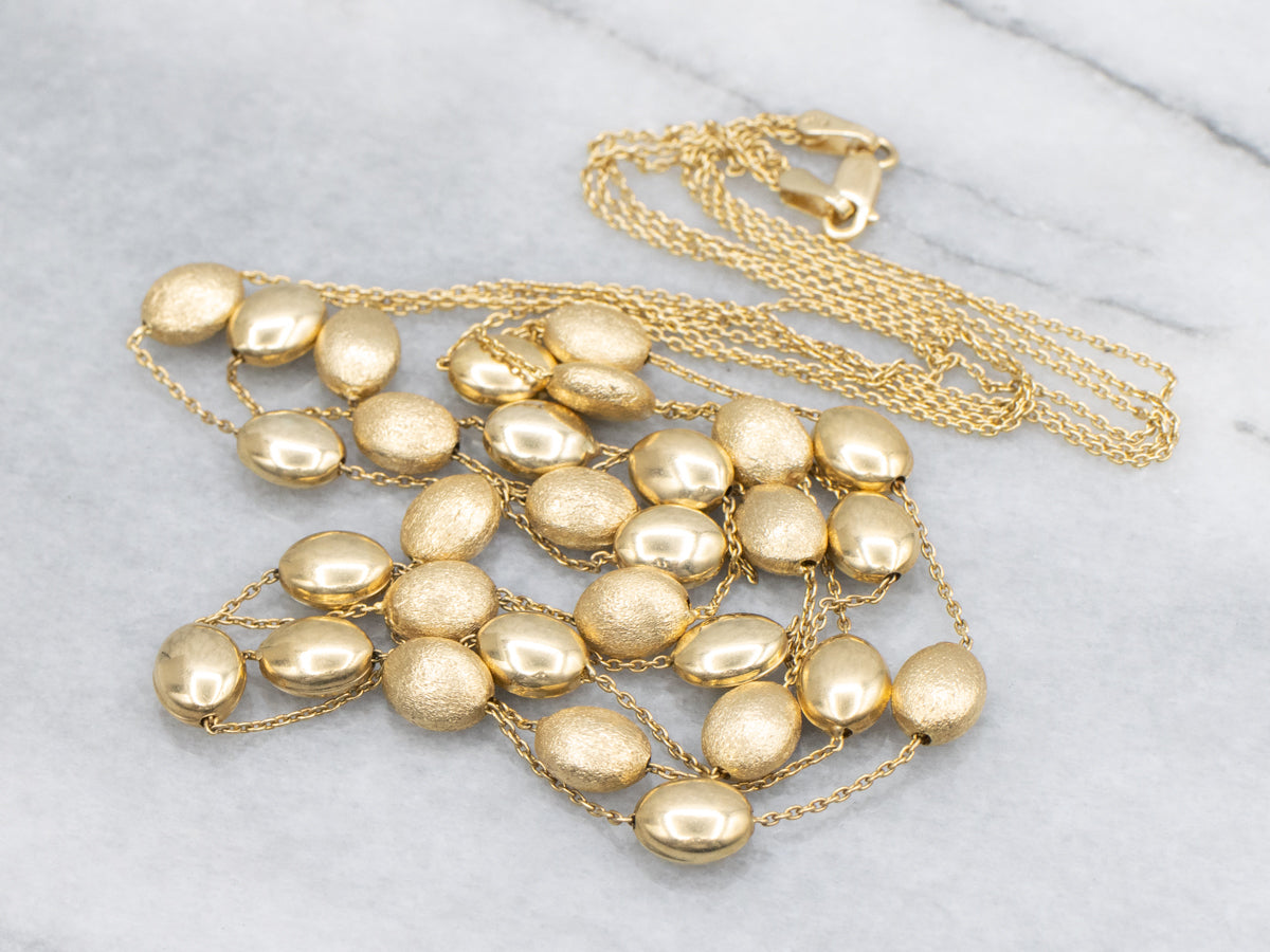 Triple Strand Textured and Polished Oval Bead Necklace