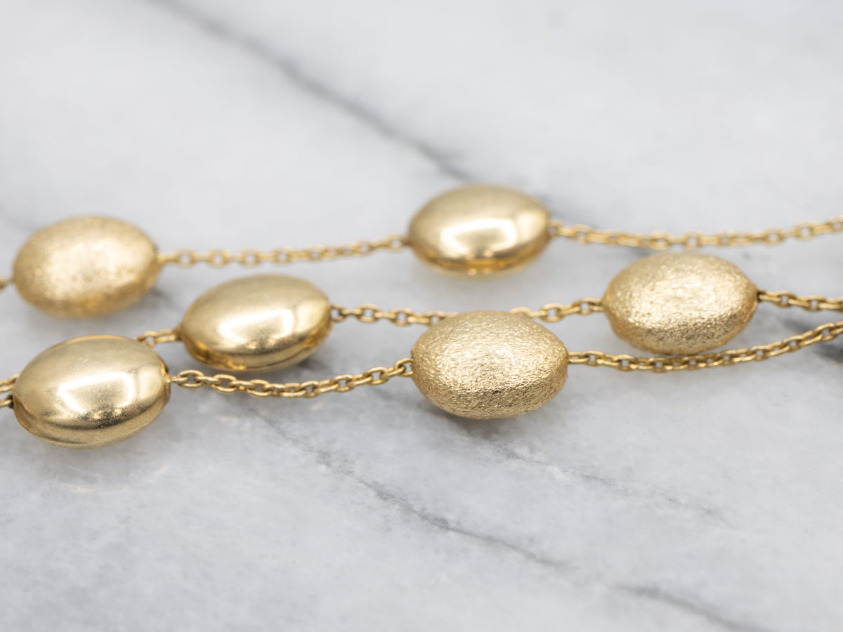 Triple Strand Textured and Polished Oval Bead Necklace