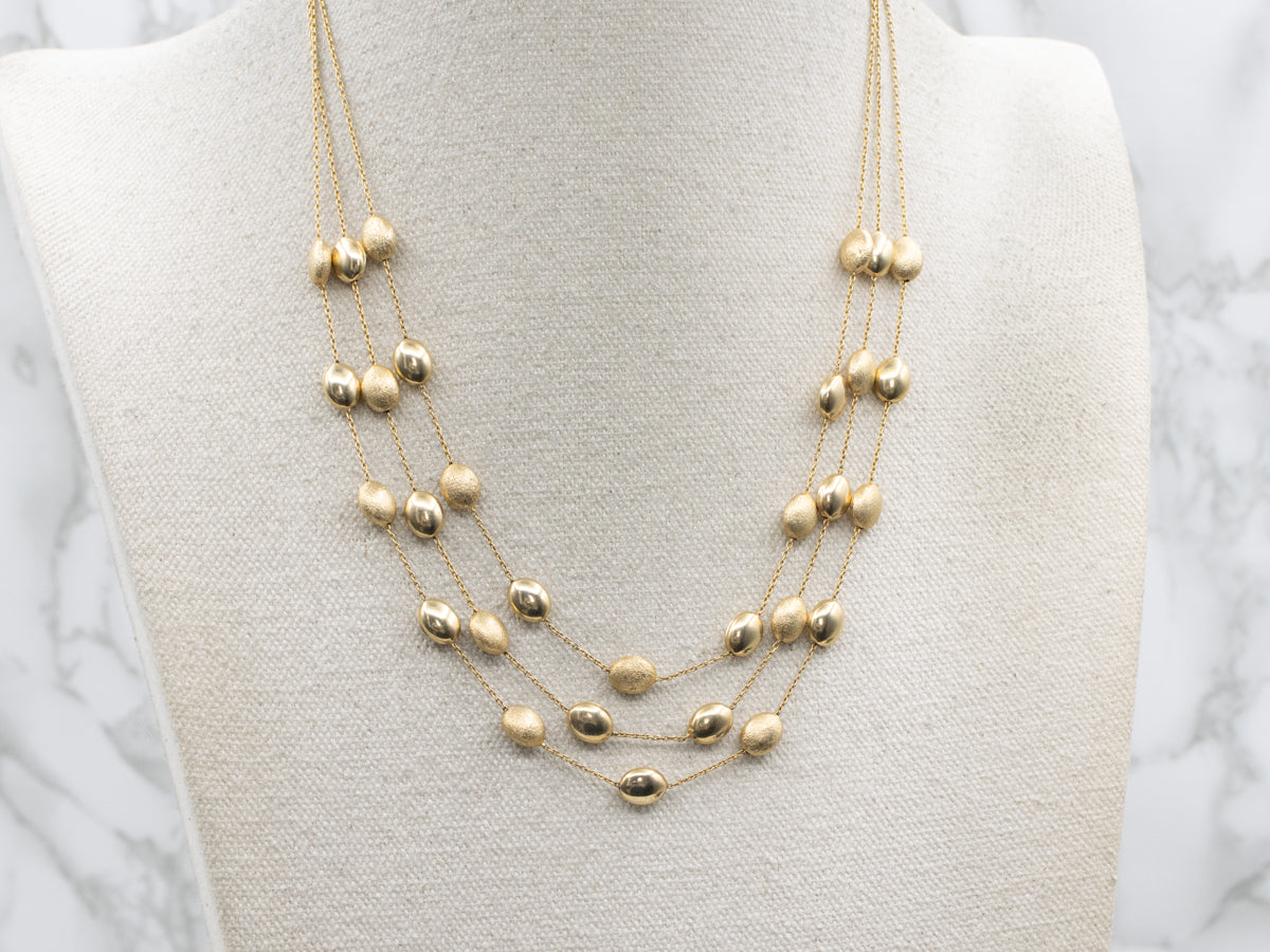 Triple Strand Textured and Polished Oval Bead Necklace