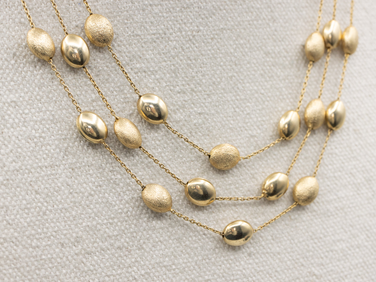 Triple Strand Textured and Polished Oval Bead Necklace