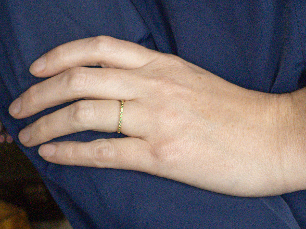 Bezel-Set Tsavorite Garnet Yellow Gold Band