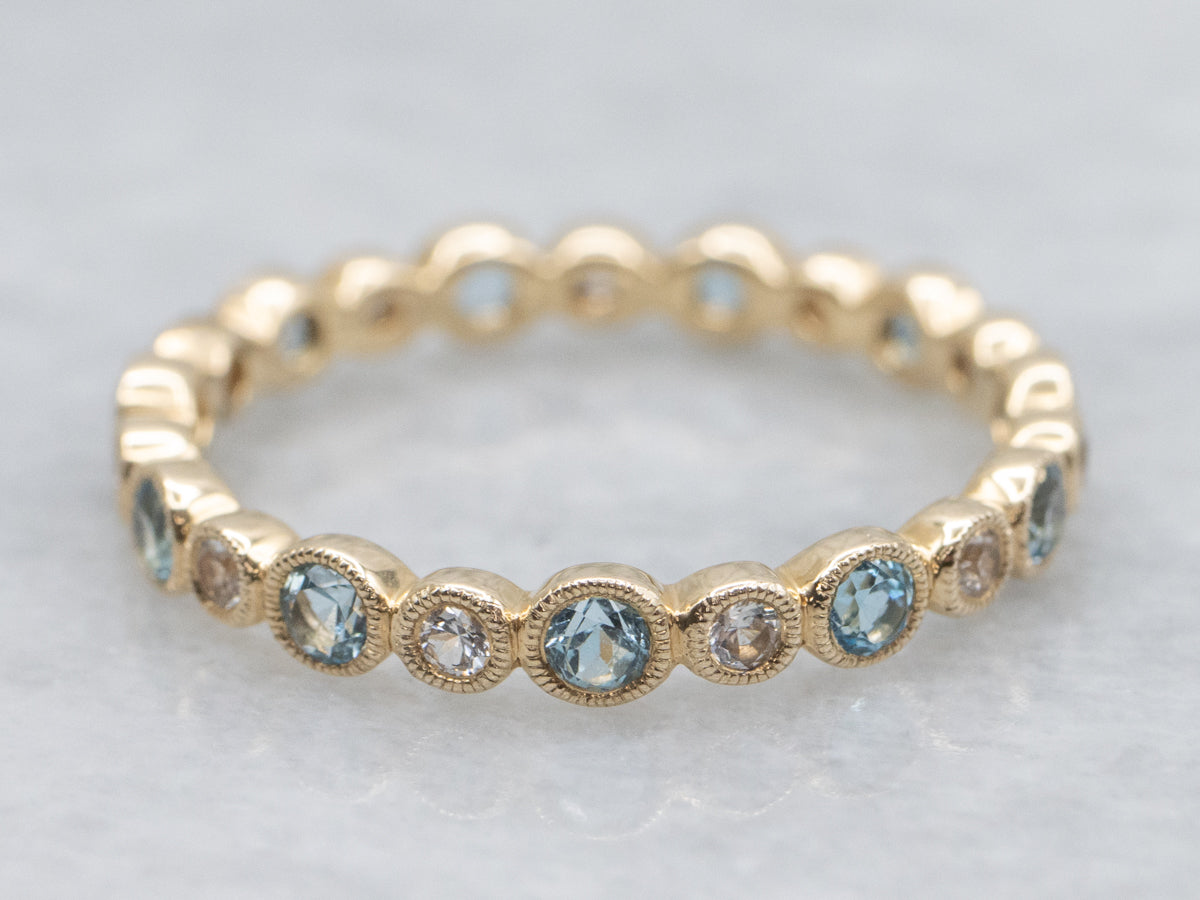 Bezel-Set Blue Topaz and White Sapphire Yellow Gold Eternity Band