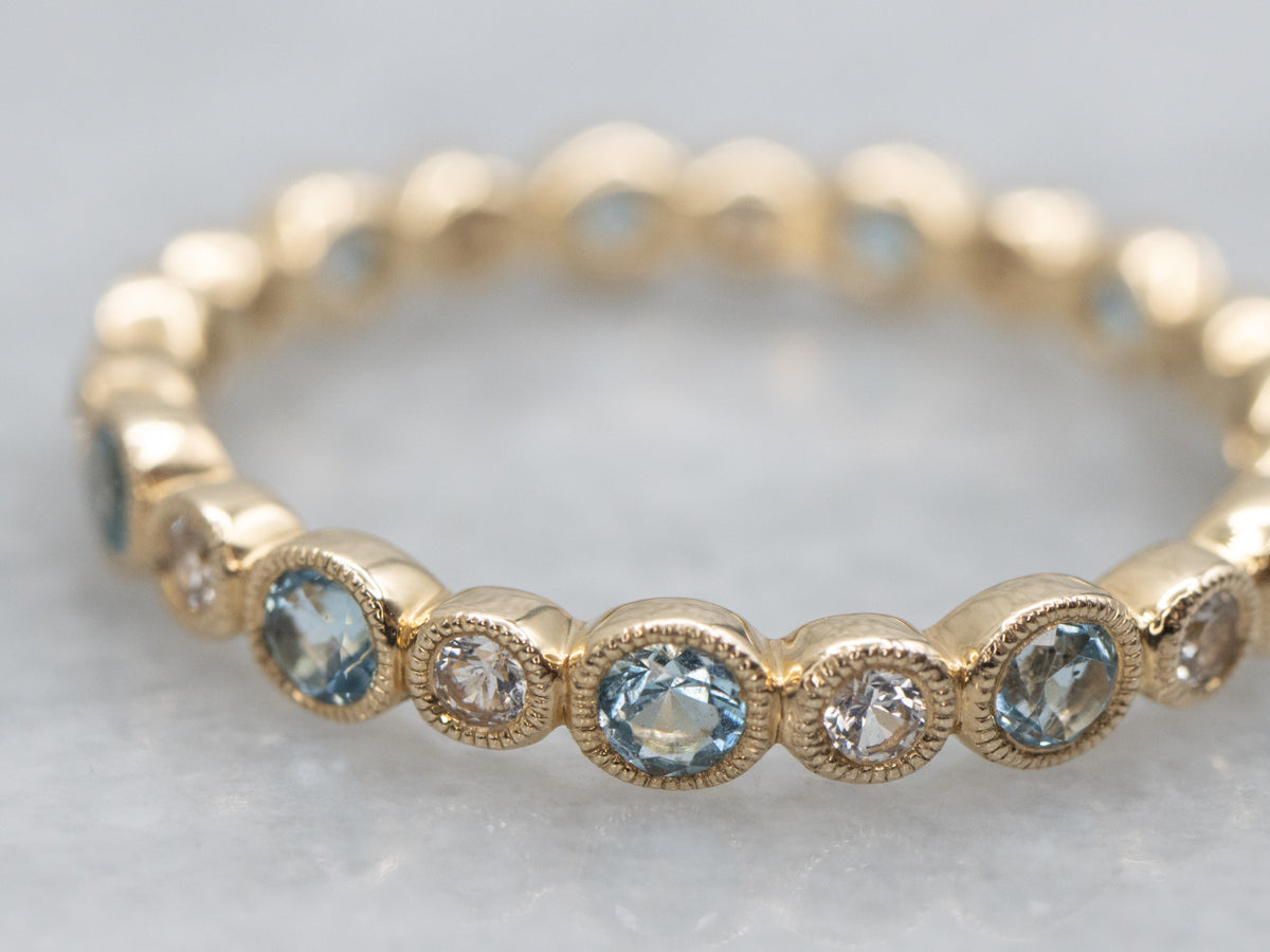 Bezel-Set Blue Topaz and White Sapphire Yellow Gold Eternity Band