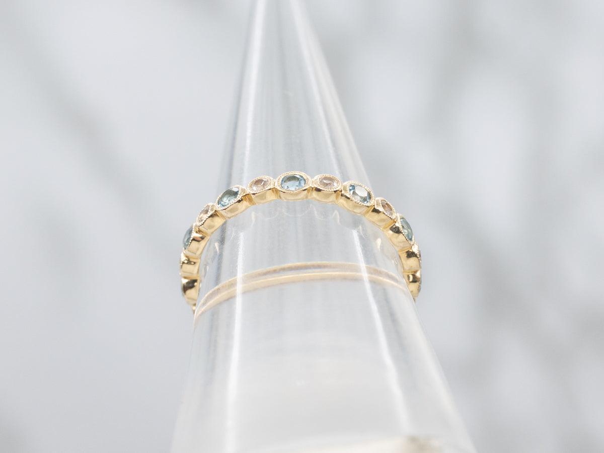 Bezel-Set Blue Topaz and White Sapphire Yellow Gold Eternity Band