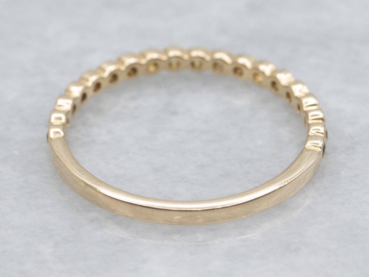 Bezel-Set Yellow Sapphire Gemstone and Gold Band