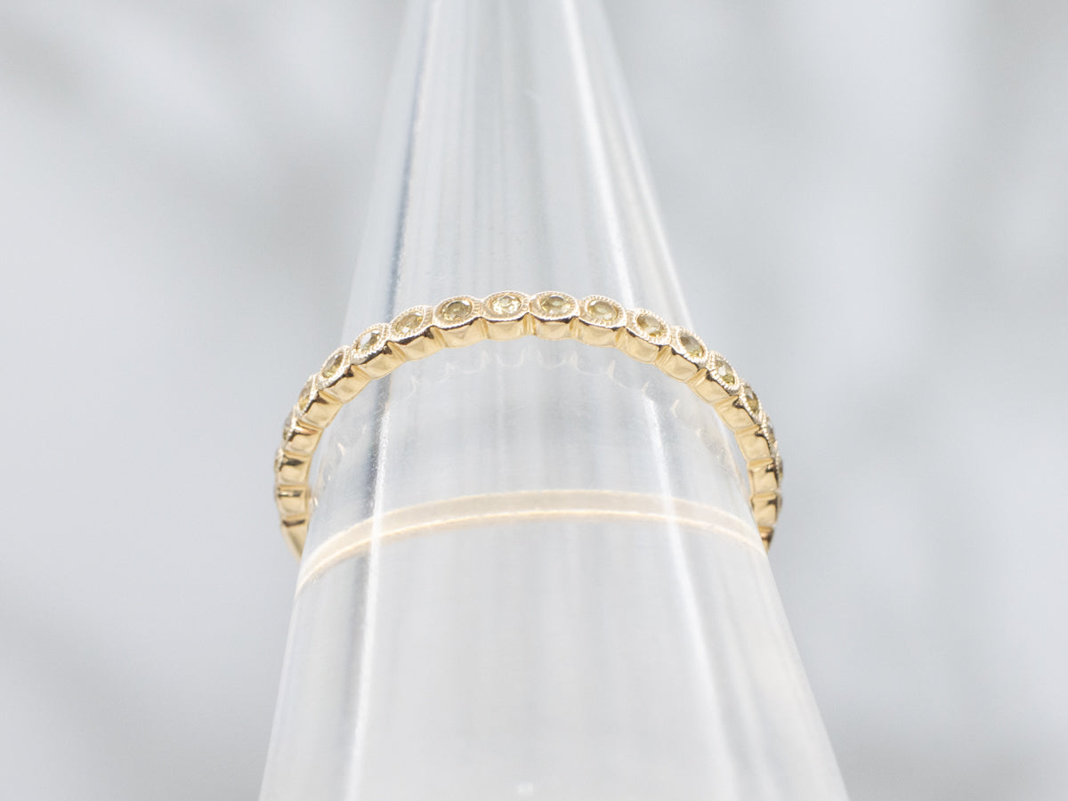 Bezel-Set Yellow Sapphire Gemstone and Gold Band