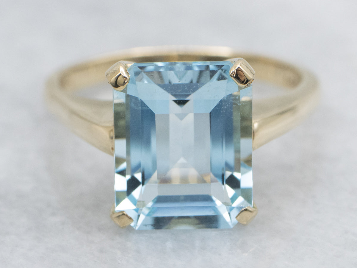 Simple Blue Topaz Yellow Gold Solitaire Ring