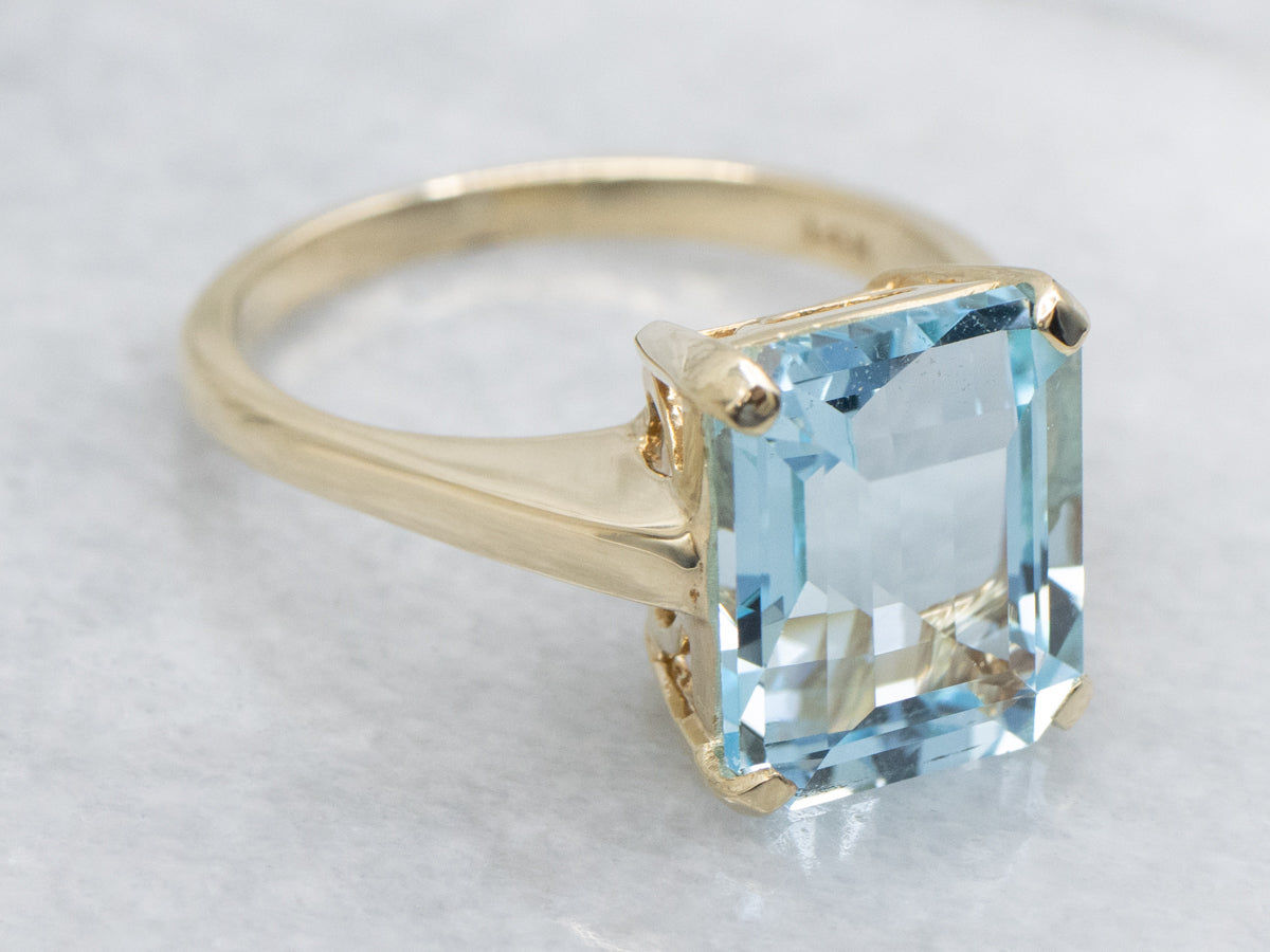 Simple Blue Topaz Yellow Gold Solitaire Ring