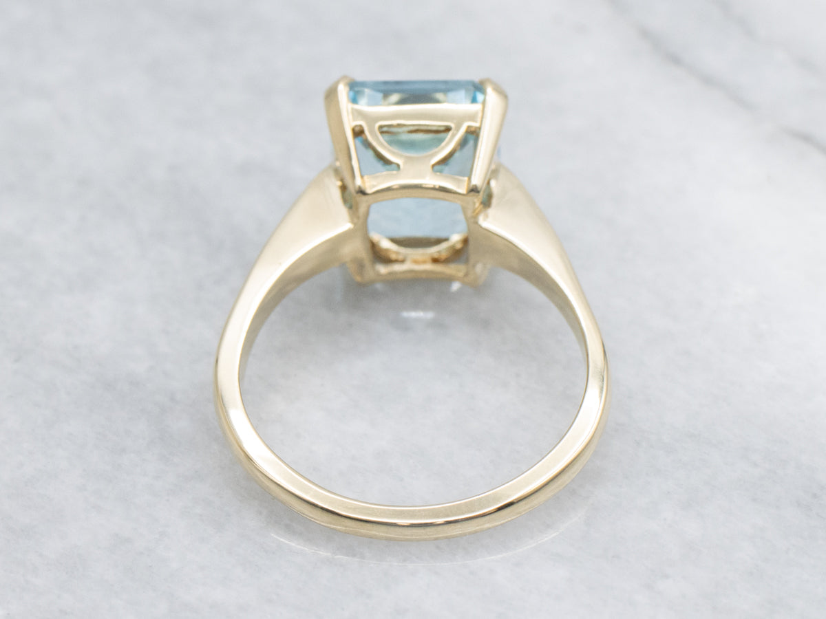 Simple Blue Topaz Yellow Gold Solitaire Ring