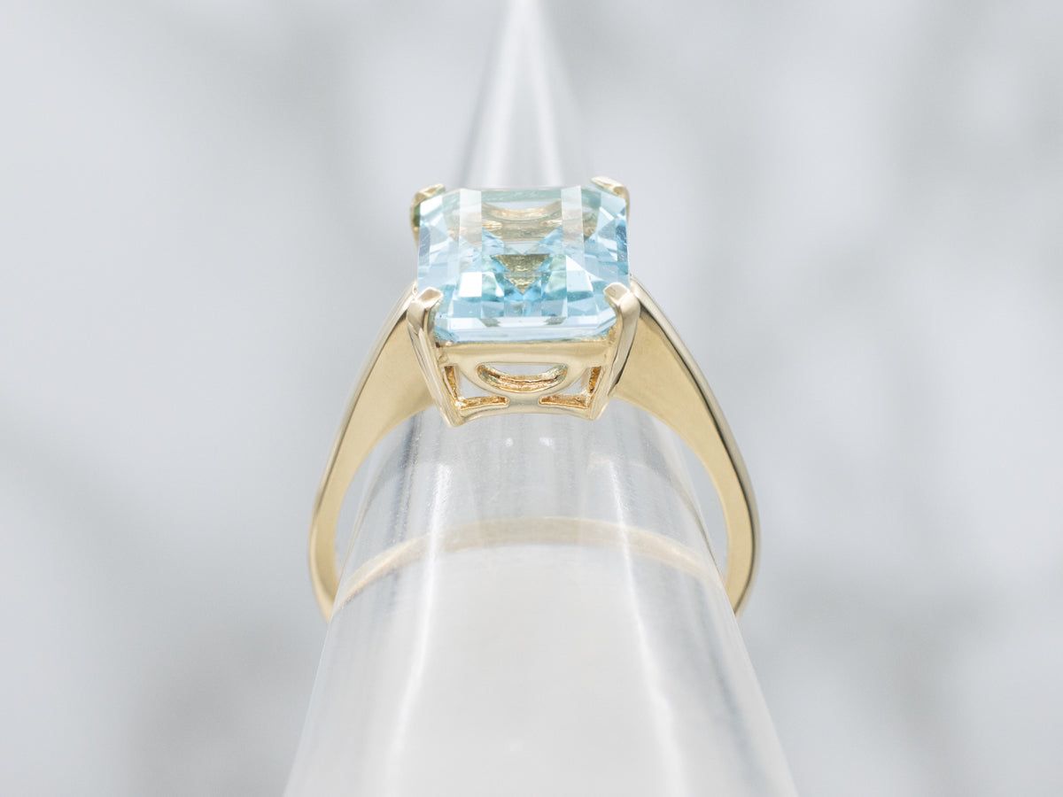 Simple Blue Topaz Yellow Gold Solitaire Ring
