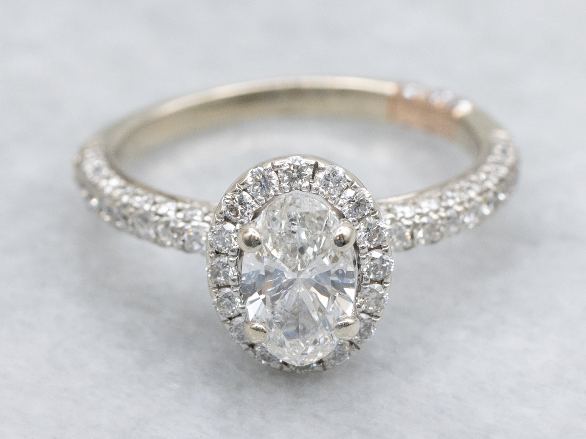 Modern Oval Diamond Halo Engagement Ring with Rose Gold Highlights
