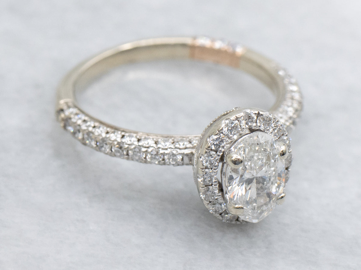 Modern Oval Diamond Halo Engagement Ring with Rose Gold Highlights