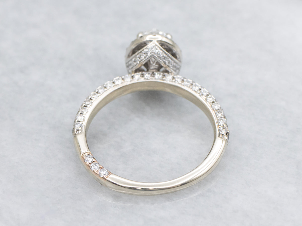 Modern Oval Diamond Halo Engagement Ring with Rose Gold Highlights