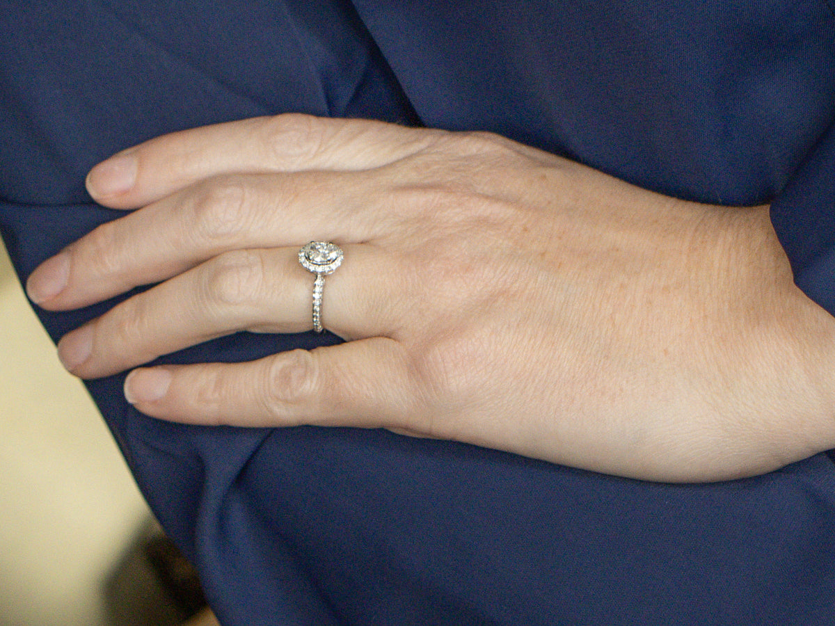 Modern Oval Diamond Halo Engagement Ring with Rose Gold Highlights