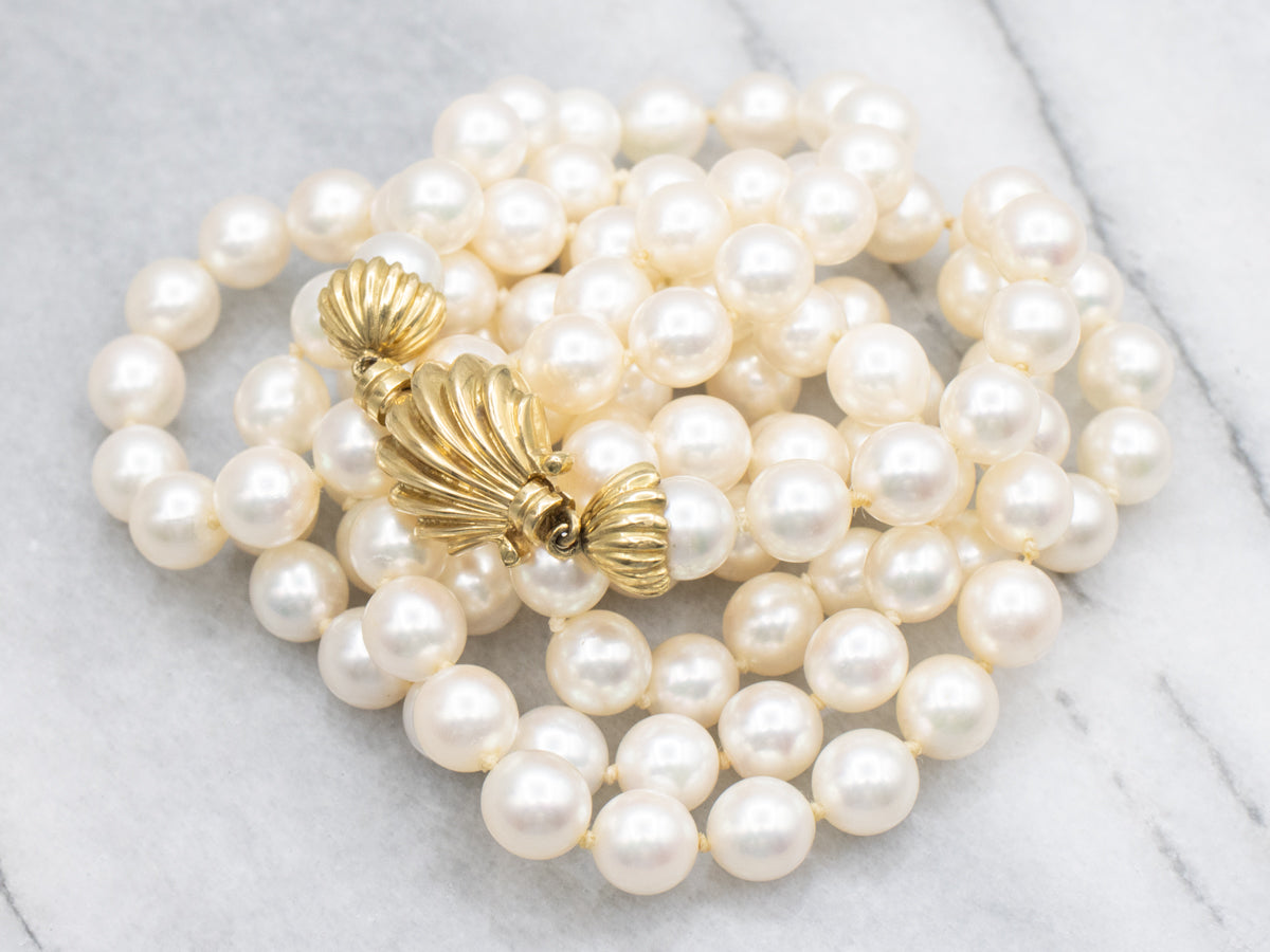 Long Pearl Strand Necklace with Gold Seashell Clasp