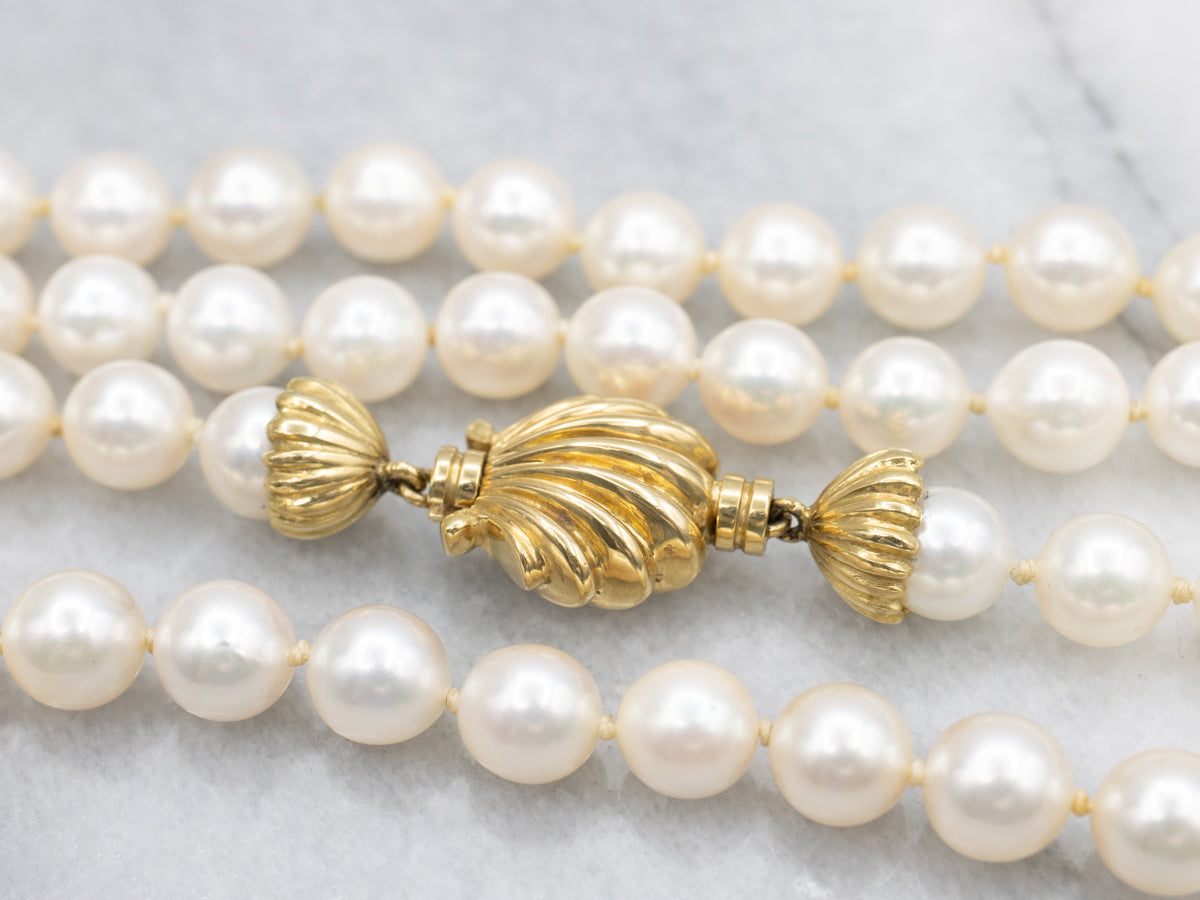 Long Pearl Strand Necklace with Gold Seashell Clasp